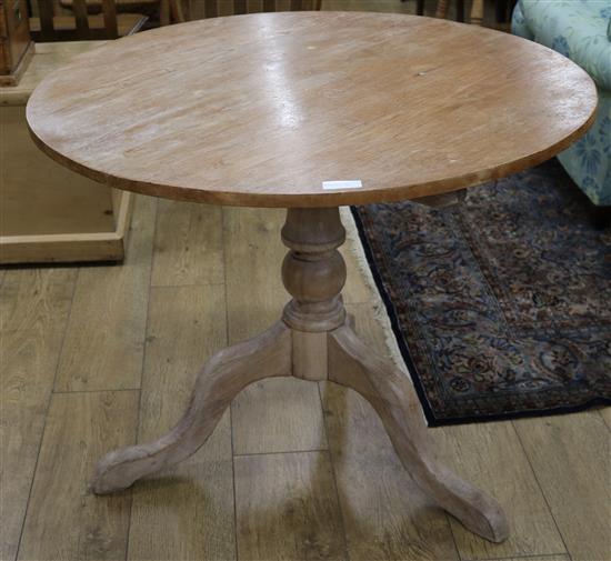 An early 19th century pine tea table